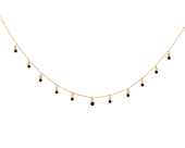 Krótki naszyjnik łańcuszkowy z okrągłymi cyrkoniami oprawionymi w złoto zwisającymi z niego na całej długości.