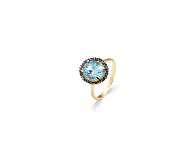 Złoty pierścionek z błękitnym kamieniem i czarnymi cyrkoniami