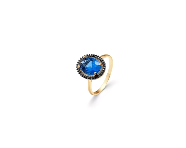 Złoty pierścionek z niebieskim kamieniem i czarnymi cyrkoniami