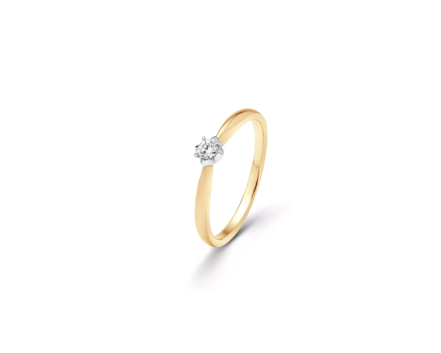 Złoty pierścionek z białym brylantem w oprawie z białego złota przypominającej lilię