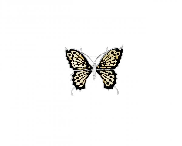 Broszka srebrna w kształcie motyla ze skrzydłami zdobionymi dwukolorowym cętkowanym bursztynem