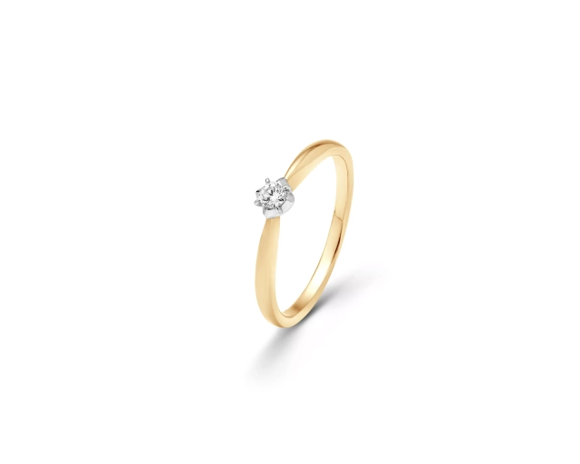Złoty pierścionek z białym brylantem w oprawie z białego złota przypominającej lilię
