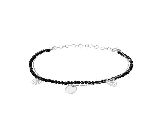 Srebrna bransoletka podwójna łańcuszkowa ze sznurem czarnych onyksów i srebrnymi okrągłymi zawieszkami.