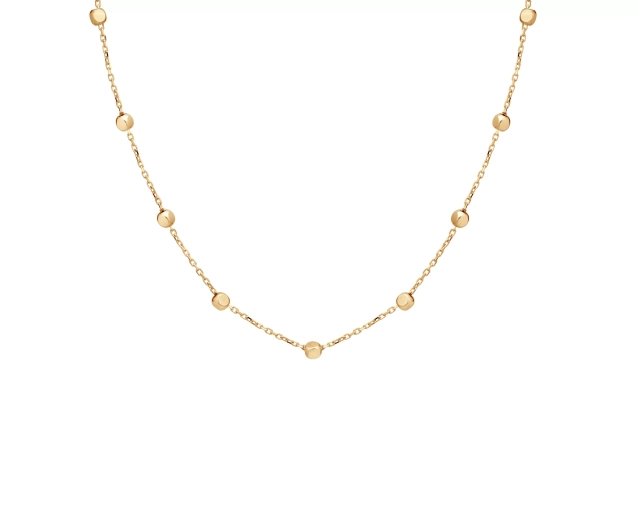 Złoty naszyjnik z delikatnymi kulkami umieszczonymi w równych odstępach
