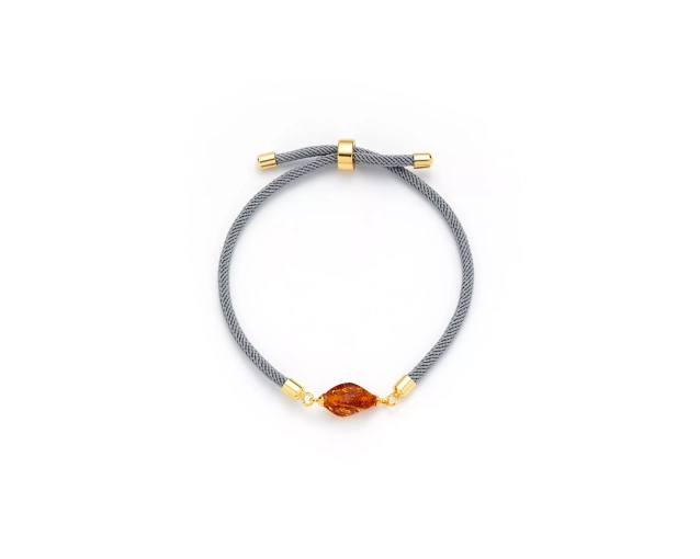 Bransoletka stalowa z bursztynem na szarym sznurku