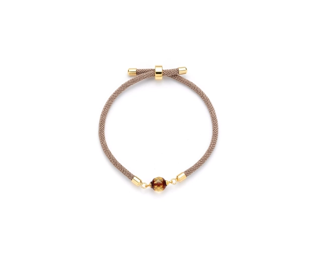 Bransoletka stalowa z kulką bursztynu na beżowym sznurku