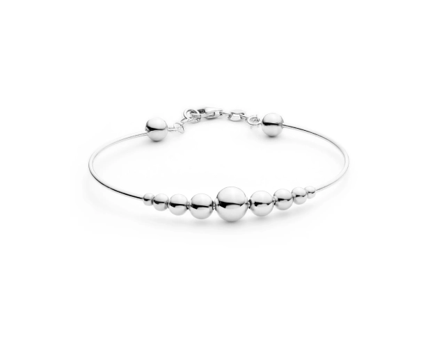 Srebrna bransoletka z połyskującymi kulkami w różnych rozmiarach