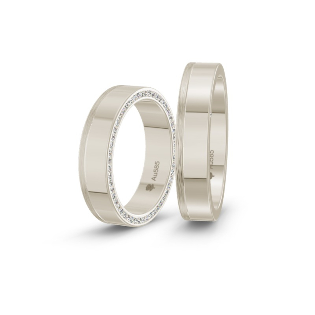 Obrączki ślubne z białego złota i diamentami na boku