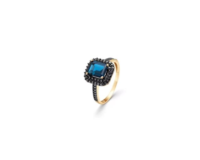 Złoty pierścionek z niebieskim kamieniem i czarnymi cyrkoniami