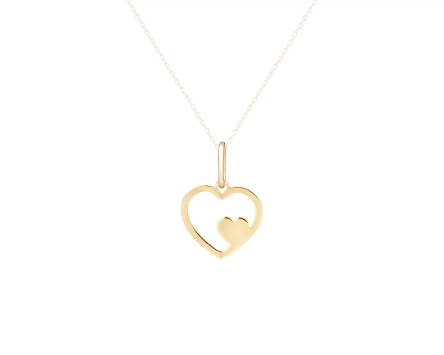 Złota zawieszka w kształcie serca, elegancja, symbol miłości, delikatny design, złoto.